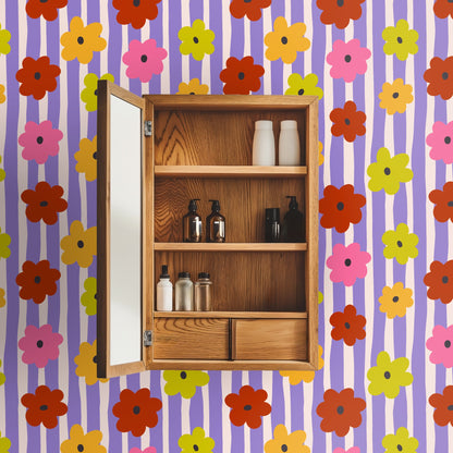 Cropped view of a bathroom medicine cabinet mounted on the Posy Parade wallpaper, illustrating scale and how the pattern works behind small,
