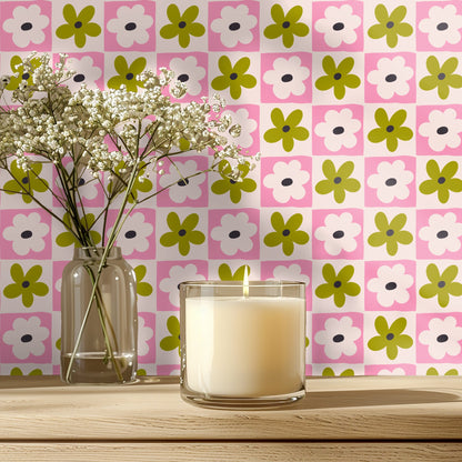 Bedroom vignette with mustard velvet headboard against Petal Grid wallpaper accent wall, showing the medium-scale checkerboard repeat.