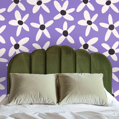 Entryway with arched opening finished in Lilac Daisy Parade wallpaper, demonstrating large-scale placement