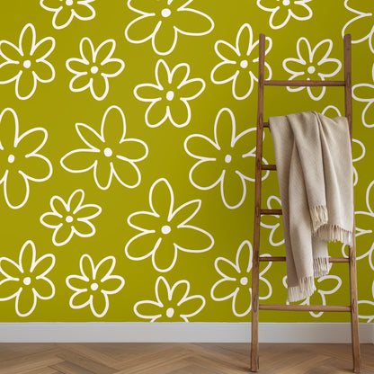 Leather club chair positioned against a chartreuse daisy wallpaper accent wall