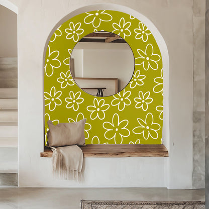 Entry alcove with round mirror framed by the chartreuse daisy wallpaper