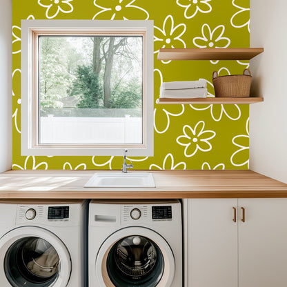 Laundry room wall behind sink and washer with playful cream daisies on chartreuse field