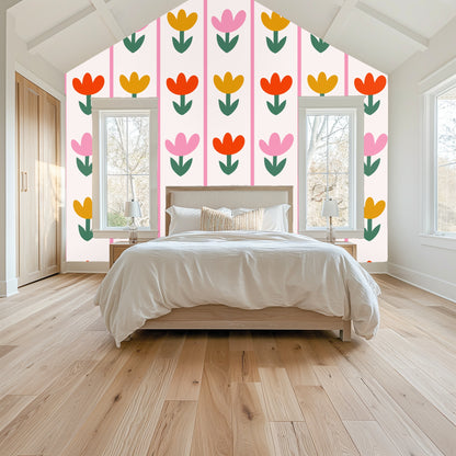 Dresser and round mirror hung over Tulip Parade wallpaper, showing pattern repeat at eye level and how it frames furnishings
