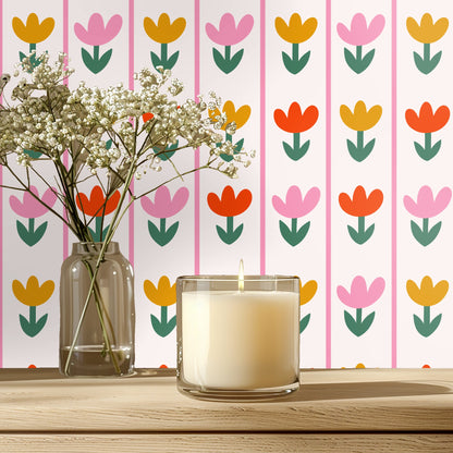 Bedroom vignette with mustard velvet headboard against Tulip Parade wallpaper, vertical pink dividers and repeating tulip columns