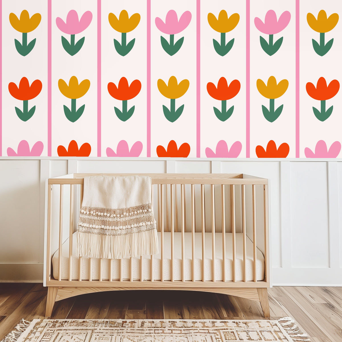 Bedroom scene with green upholstered headboard against Tulip Parade wallpaper, demonstrating the vertical lift of the stripe columns