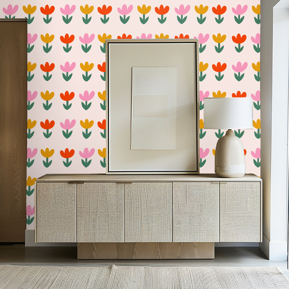 Living room vignette: Bold tulip repeat behind an orange sofa and warm-toned rug creating a retro-modern lounge feel