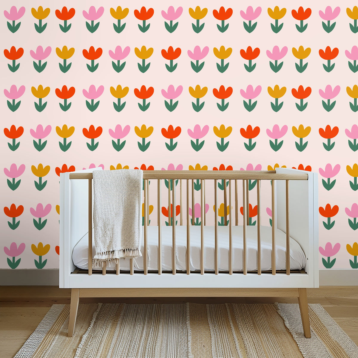 Casual living room: Tulip repeat scaled across a full wall behind a neutral sofa and low coffee table