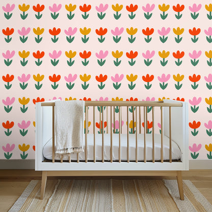 Casual living room: Tulip repeat scaled across a full wall behind a neutral sofa and low coffee table