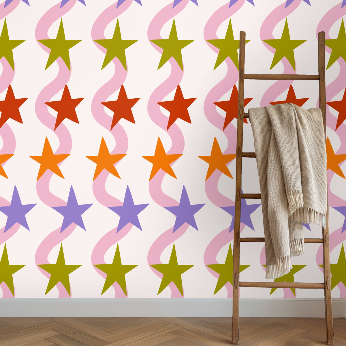 Floor-to-ceiling wallpaper view highlighting the alternating star colors and generous repeat scale
