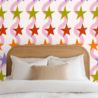 Styled bedroom with rattan headboard and Starlane Ribbon wallpaper as an accent behind the bed