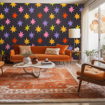 Living room vignette with Nocturne Starburst accent wall, orange sofa and warm wood accents