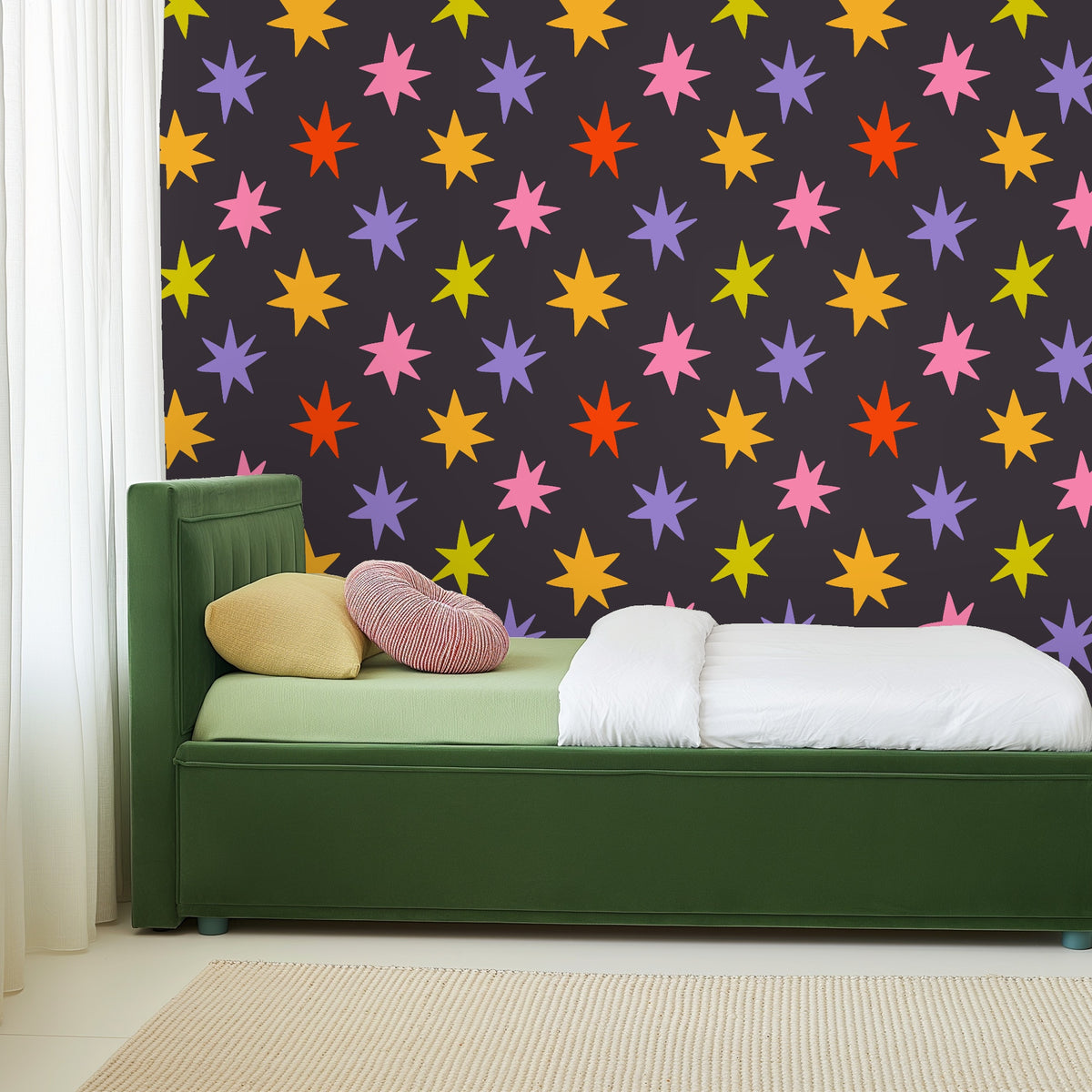 Large-scale repeat of Nocturne Starburst pattern, showing even spacing of colorful star motifs on charcoal ground