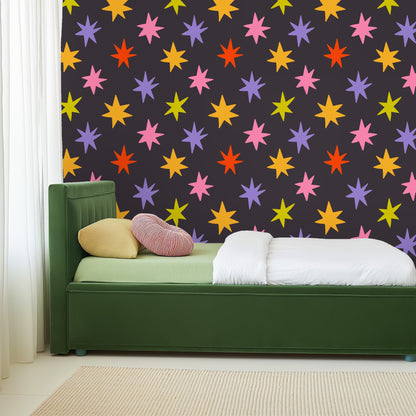 Large-scale repeat of Nocturne Starburst pattern, showing even spacing of colorful star motifs on charcoal ground