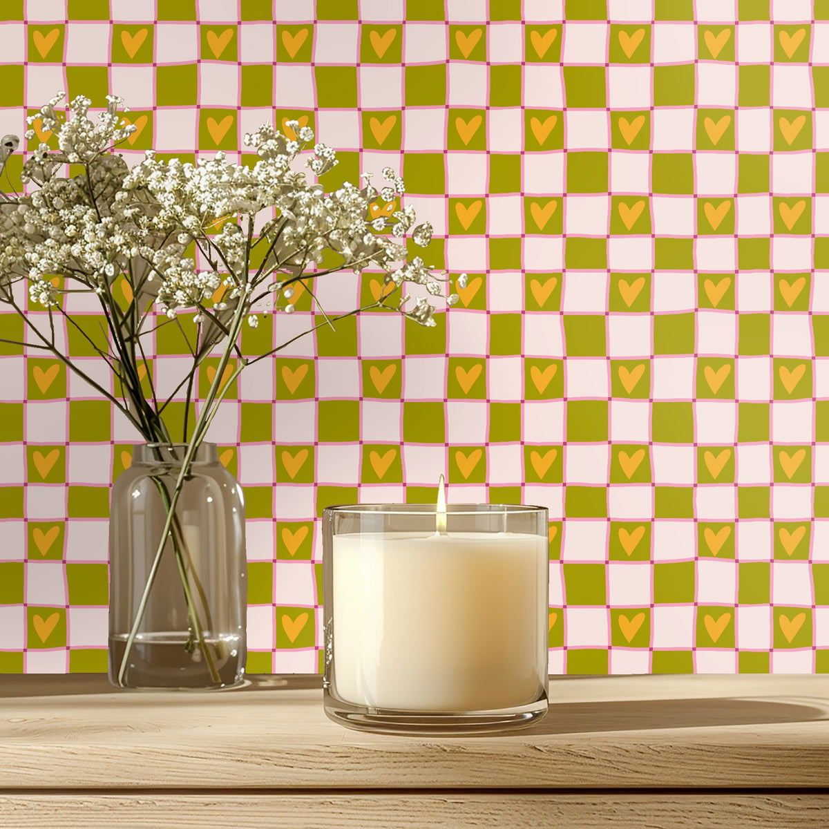Close-up of hand-drawn check pattern with olive and blush squares, pink brush lines and mustard heart motif