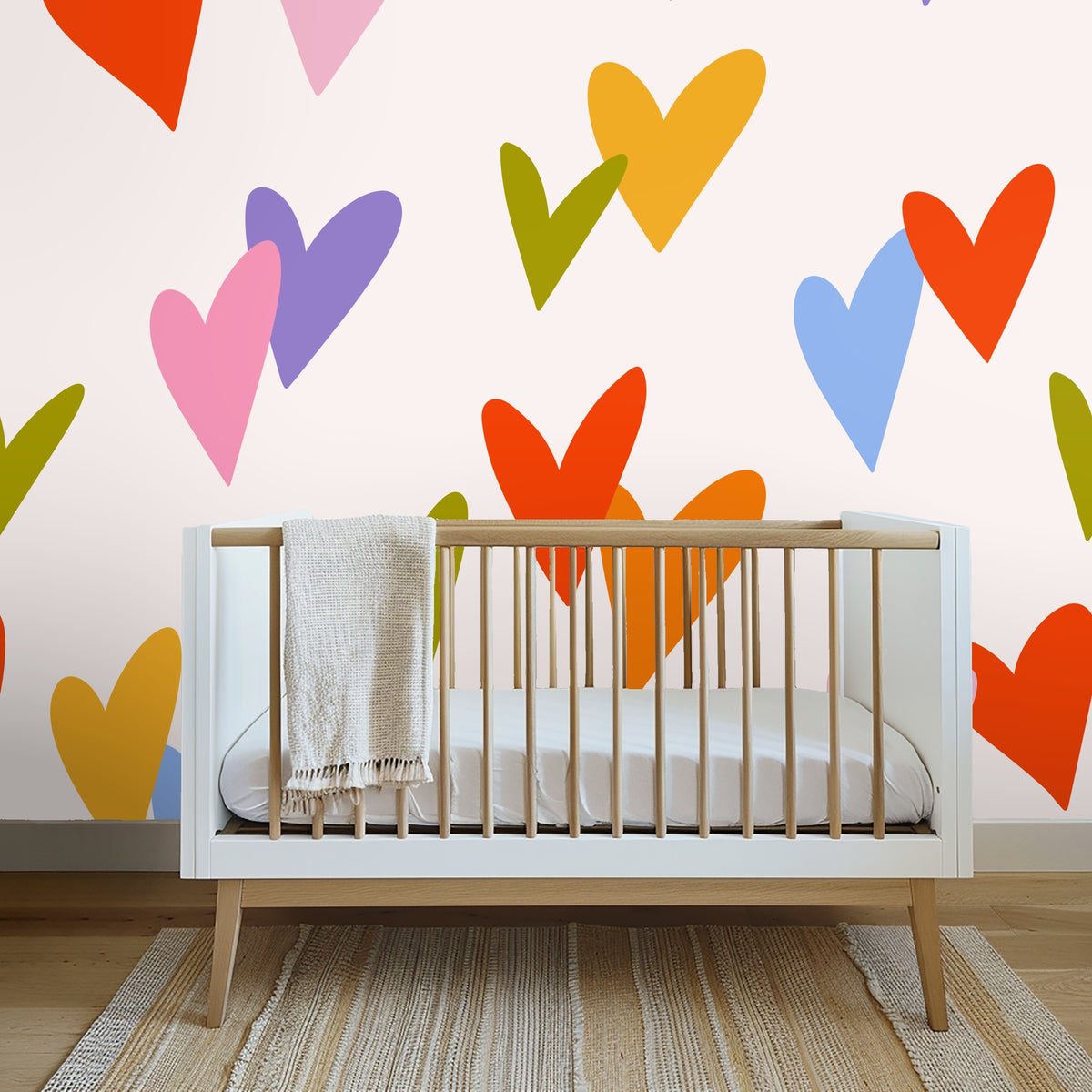 Wide room view showing the pattern scaled as an accent wall behind a bed flanked by windows and light wood floors