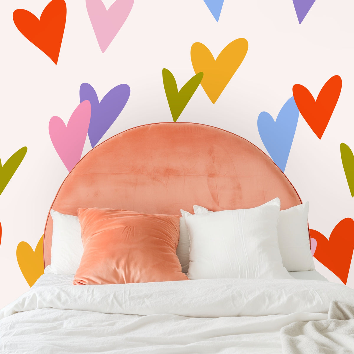 Close-up of the Sweetheart Scatter pattern showing oversized hand-drawn hearts in red-orange, pink, periwinkle, lavender, olive and yellowon