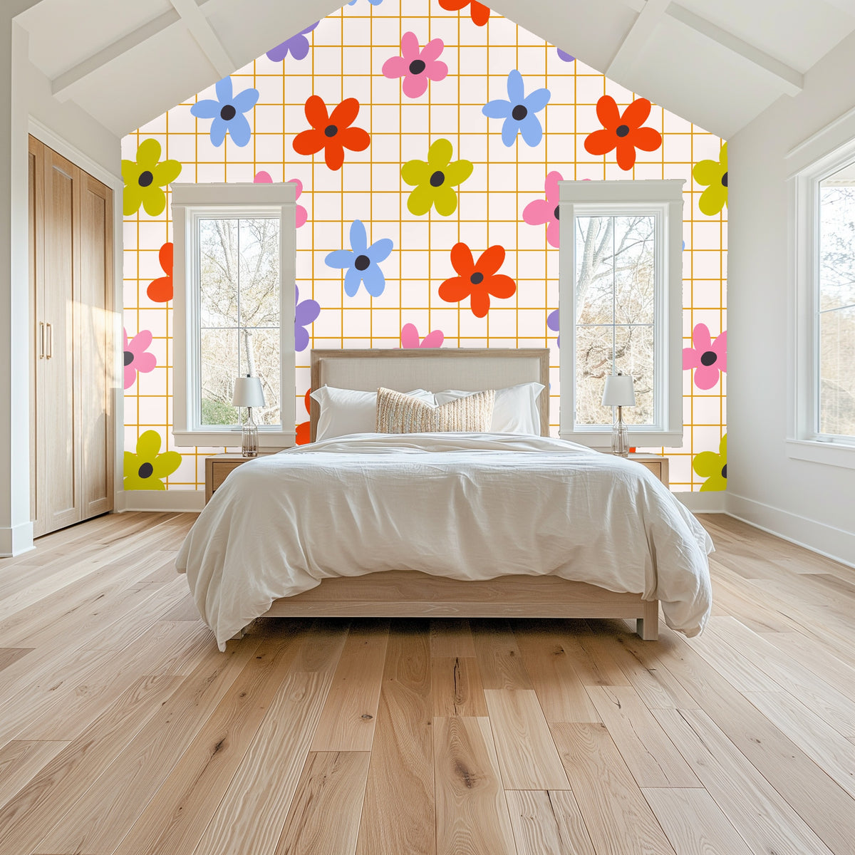 Green upholstered headboard with the Floragraph Grid wallpaper behind as a bedroom focal wall