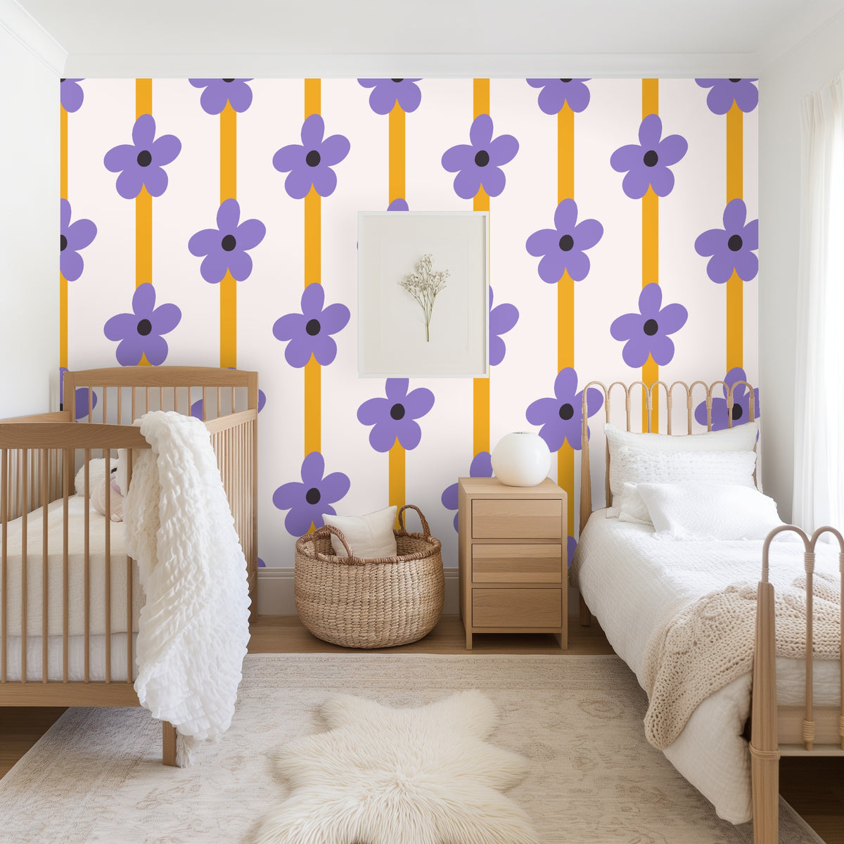 Wallpaper styled with a wooden ladder and a neutral fringed blanket, showing repeated flowers and stripes