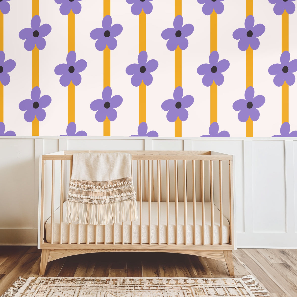 Close-up of pattern: oversized lilac five-petal flower with dark charcoal center over a mustard vertical stripe on a pale blush background