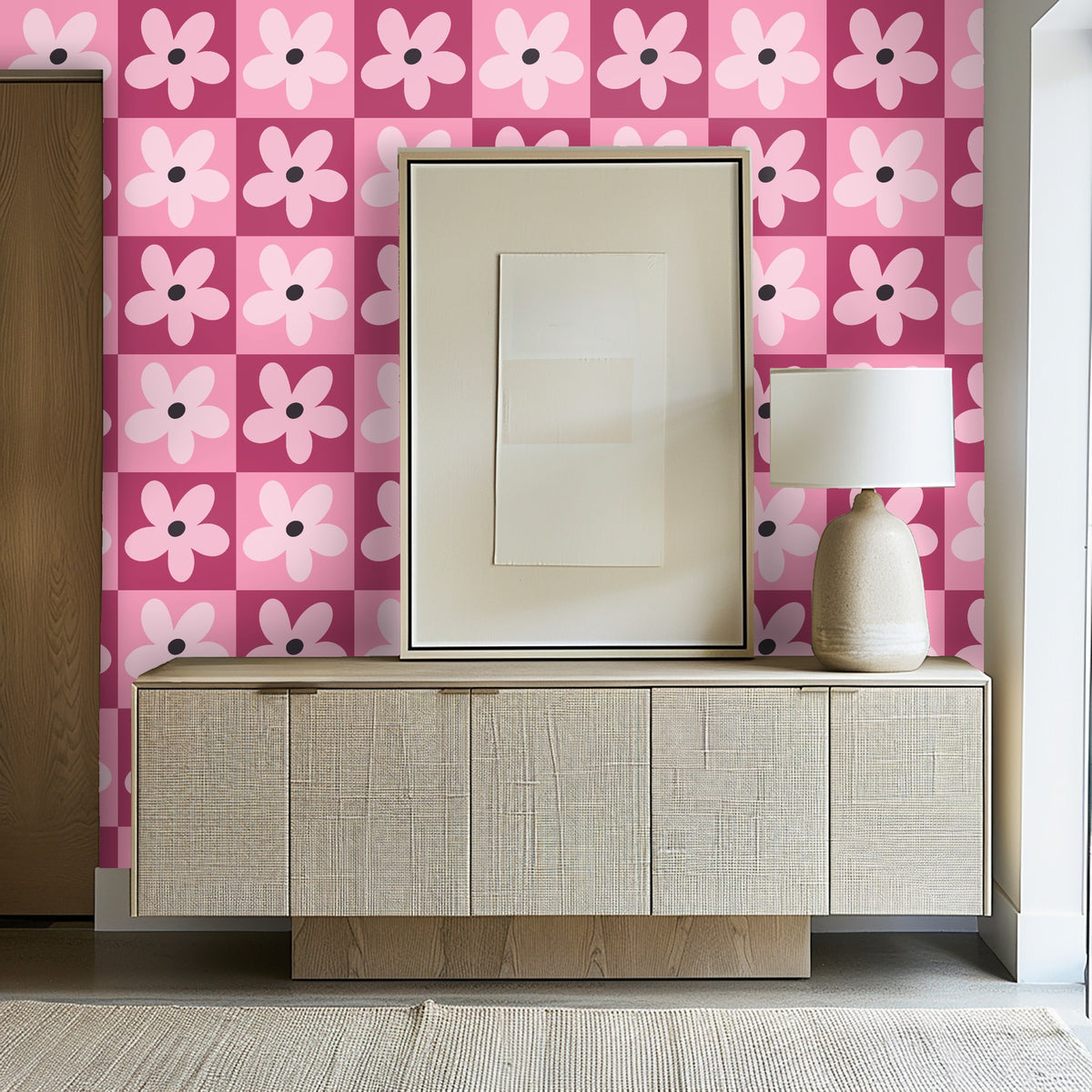 Living room scene with bold pink floral wallpaper behind an orange sofa for a retro-modern contrast.