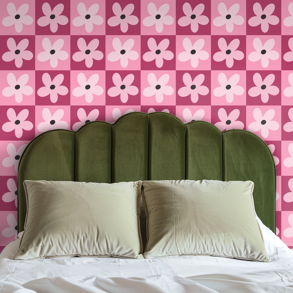 Console table vignette with framed art and lamp in front of the pink gridflower wallpaper.