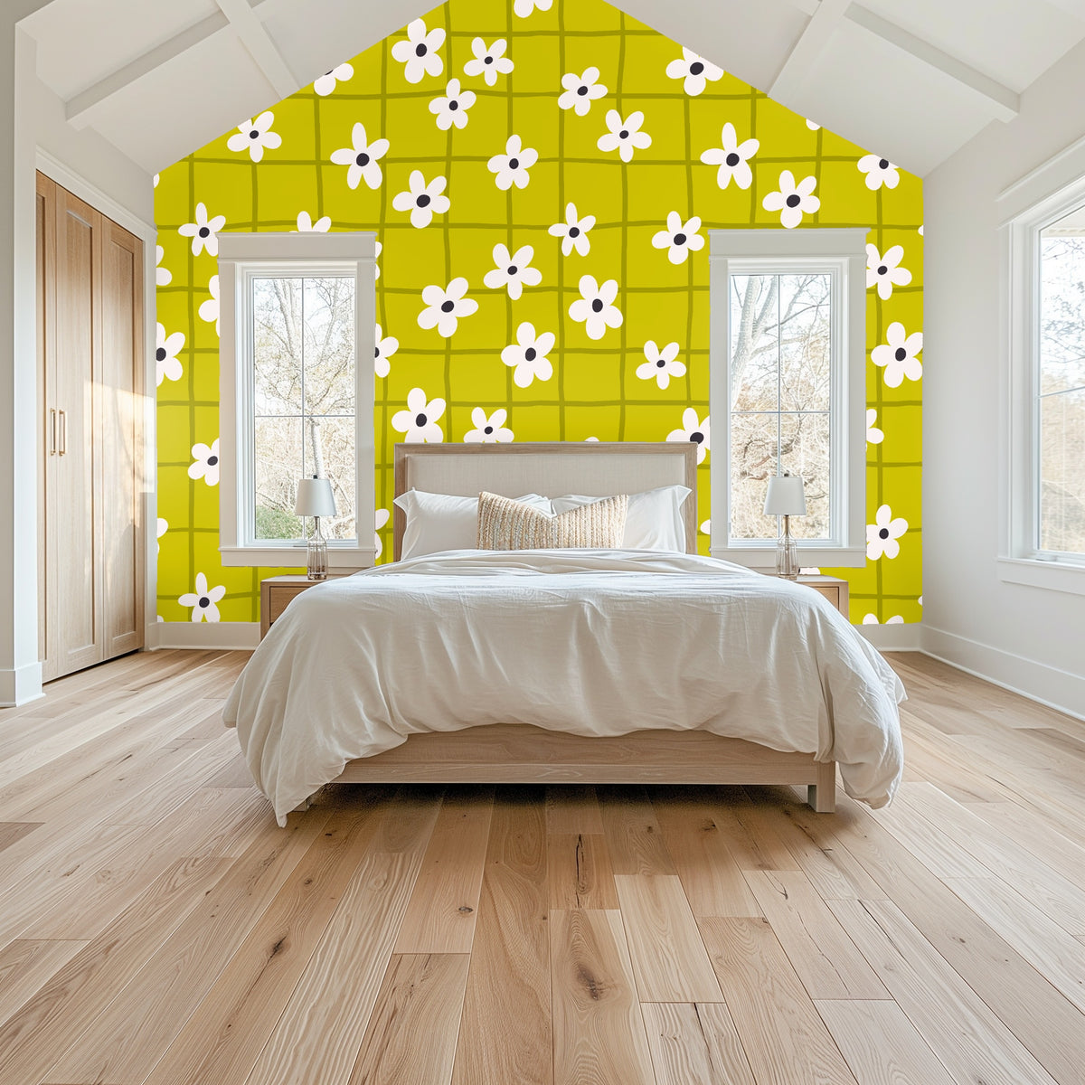 Bedroom headboard shot showing wallpaper behind a mustard velvet headboard with scattered white flowers on a chartreuse grid