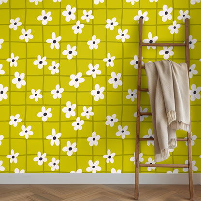 Repeat pattern sample with evenly spaced cream flowers and irregular olive grid lines across chartreuse ground