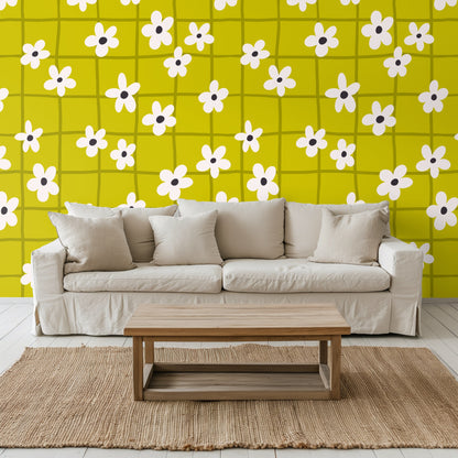 Living room vignette with leather chair against the chartreuse floral grid wallpaper