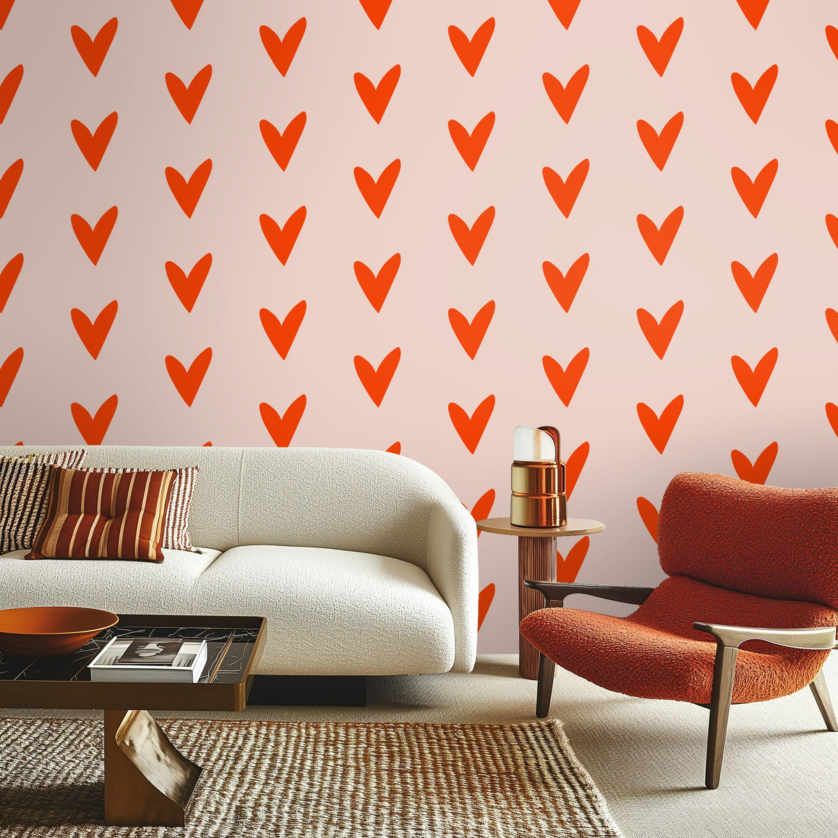 View through an arch to a bench and rug with the coral heart wallpaper creating a bold focal wall.