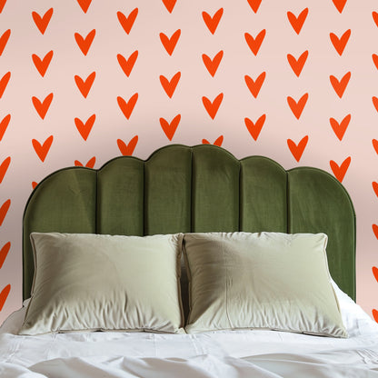 Close crop showing the staggered rows of hand-drawn hearts and the soft blush field.