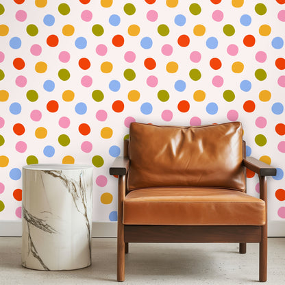 Bedroom vignette with a rattan headboard against Palm Dot Parade wallpaper, showing medium-scale colorful dots