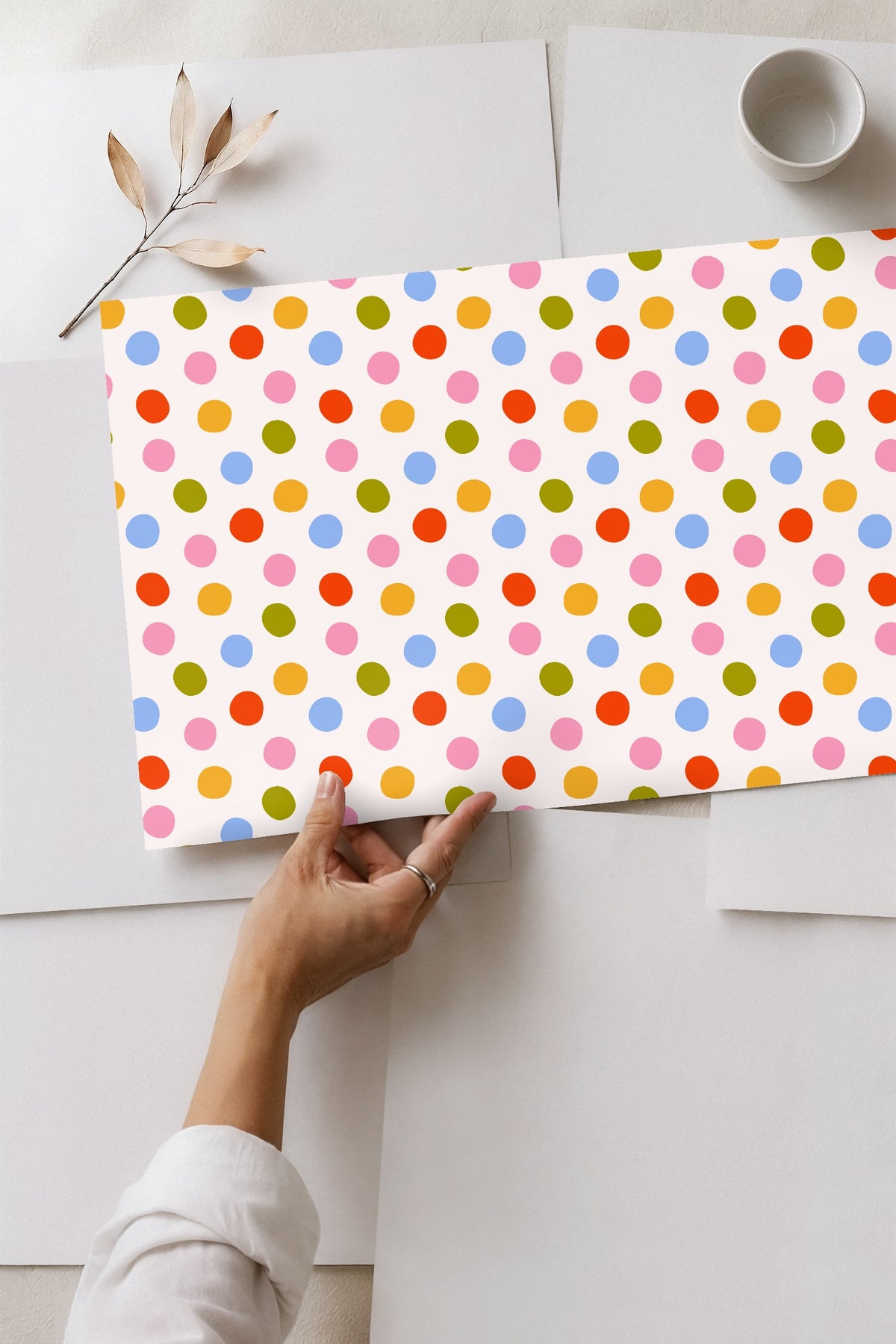Detail view of wallpaper with mirror reflection, emphasizing texture-free flat color dots
