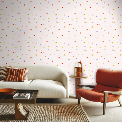 Detail of wallpaper pattern behind a tabletop, highlighting coral, marigold, lilac and pink dots.