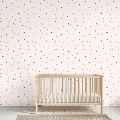 Full repeat view of Sweet Spot Polka pattern: irregular multicolor dots on a pale blush background.