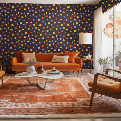 Living room vignette: rich orange sofa against the Nightfall Confetti wallpaper accent wall