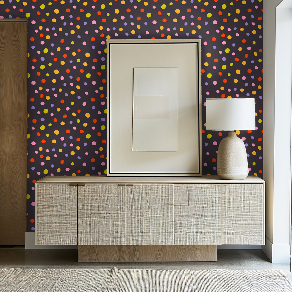 Full pattern view: charcoal background scattered with irregular multicolor polka dots in pink, lavender, orange, red and chartreuse