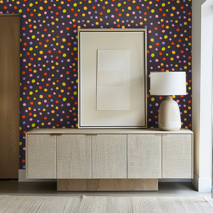 Full pattern view: charcoal background scattered with irregular multicolor polka dots in pink, lavender, orange, red and chartreuse