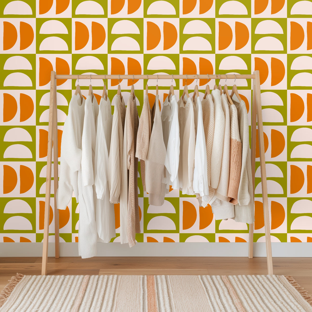 Close-up of the Quartermoon Grid artwork showing alternating blush semicircles and tangerine half-disks on an olive grid.