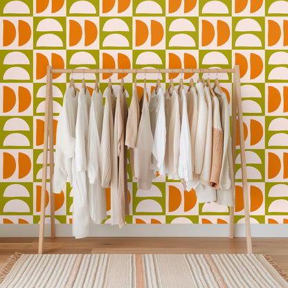 Close-up of the Quartermoon Grid artwork showing alternating blush semicircles and tangerine half-disks on an olive grid.