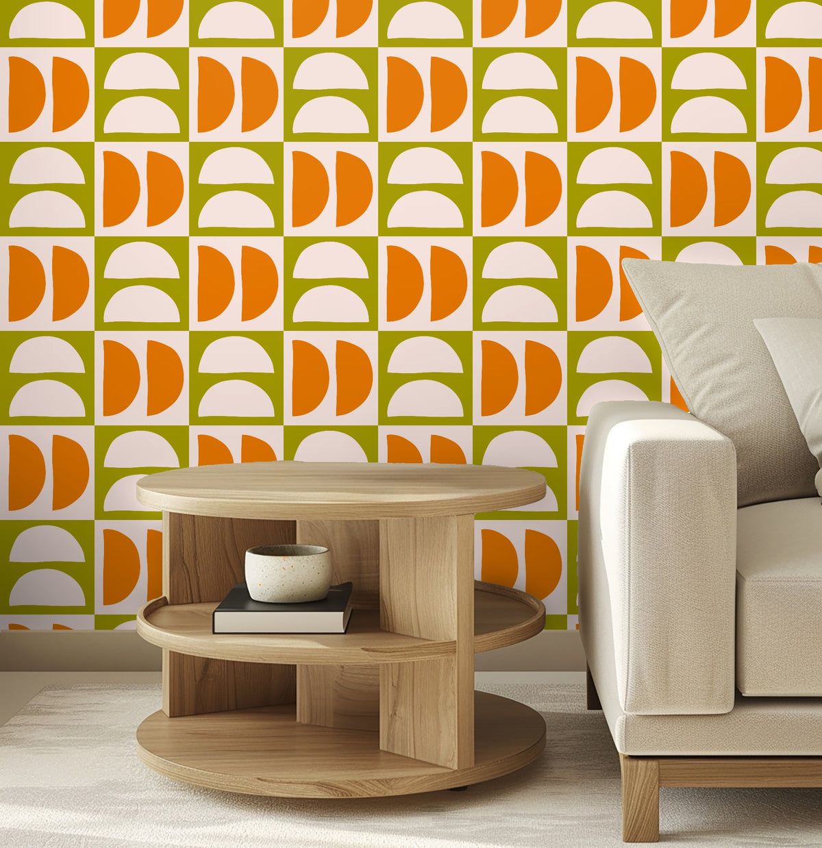Full-wall view of the tiled repeat: blush semicircles and tangerine half-disks on olive squares across a room wall.