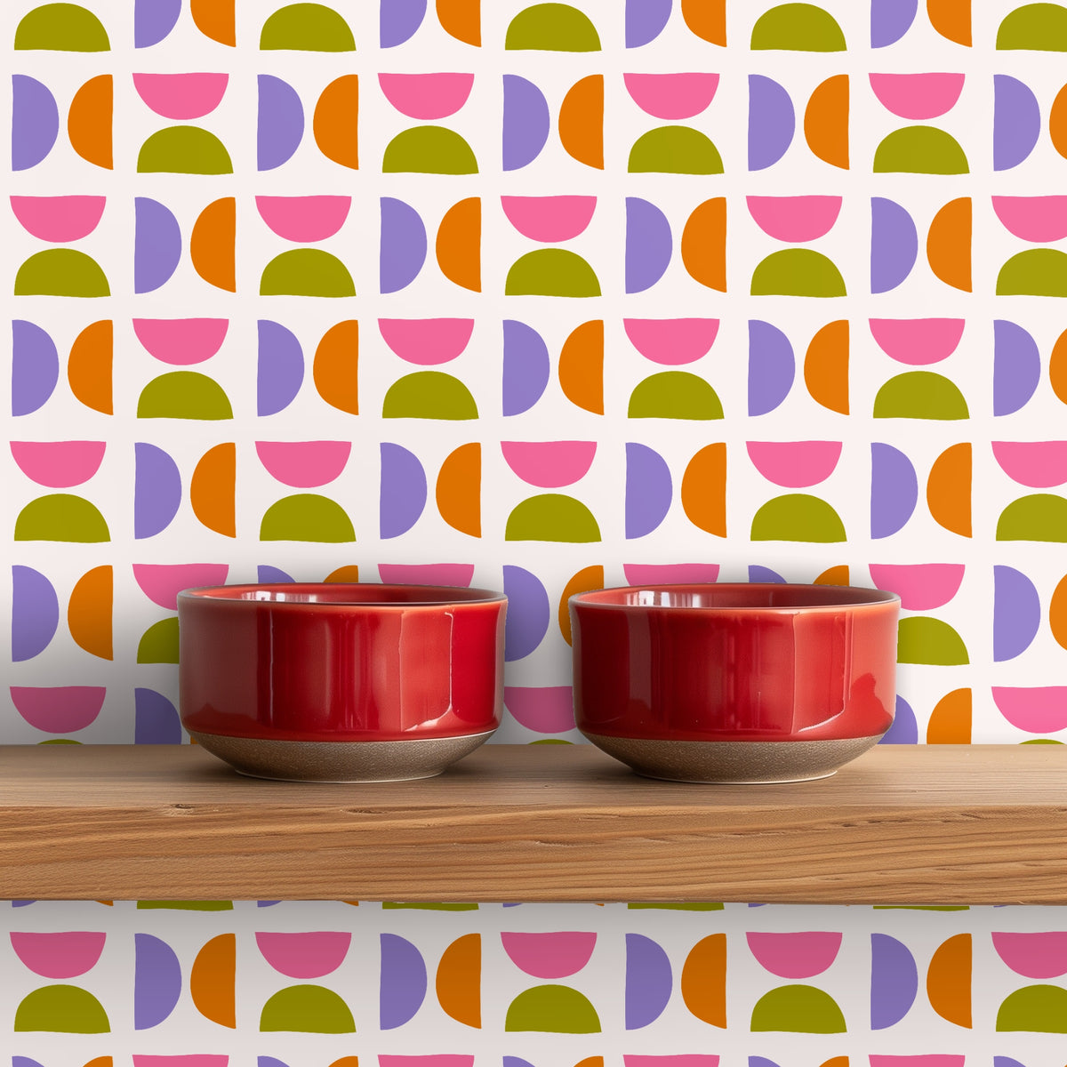 Kitchen shelf scene with two red bowls in front of the wallpaper, demonstrating pattern scale and how it layers with tabletop objects.