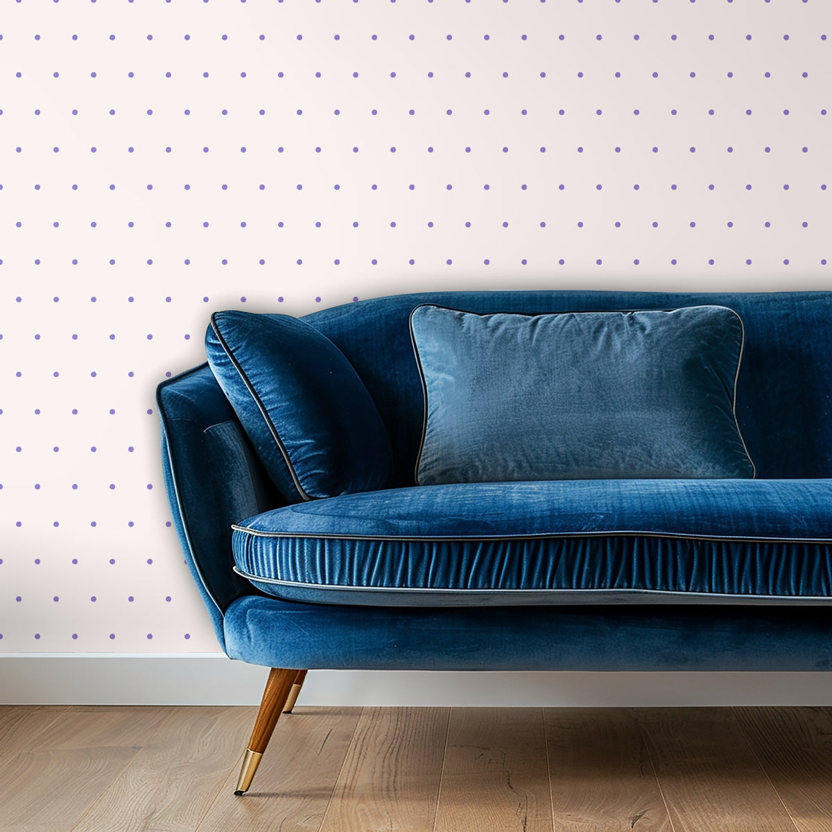 Blue velvet sofa set in front of the dotted wallpaper illustrating dot scale and contrast