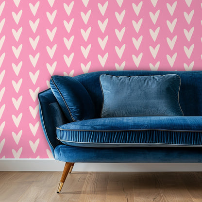 Heart wallpaper behind a deep blue velvet sofa, demonstrating a contrast pairing with jewel tones.