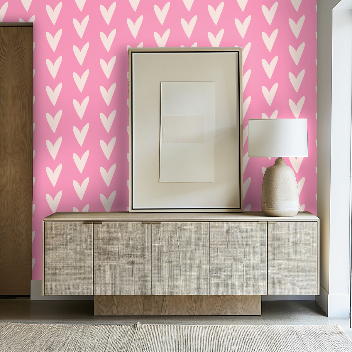 Entryway composition with the wallpaper behind a woven-front sideboard and framed art for a lively first impression.