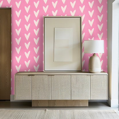 Entryway composition with the wallpaper behind a woven-front sideboard and framed art for a lively first impression.