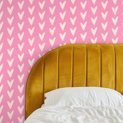 Bedroom vignette showing the wallpaper behind a mustard velvet headboard for a bold, playful focal point.