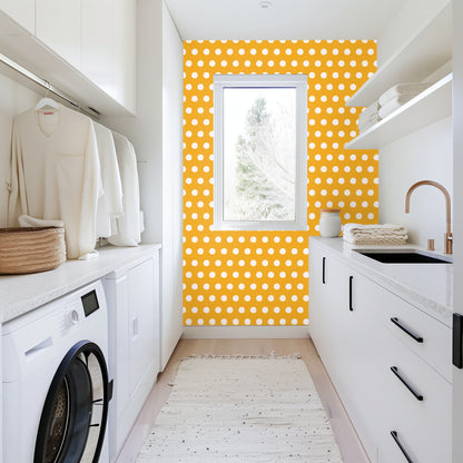Close-up wall sample showing medium-scale dots and the even grid that creates a steady rhythm across a room.