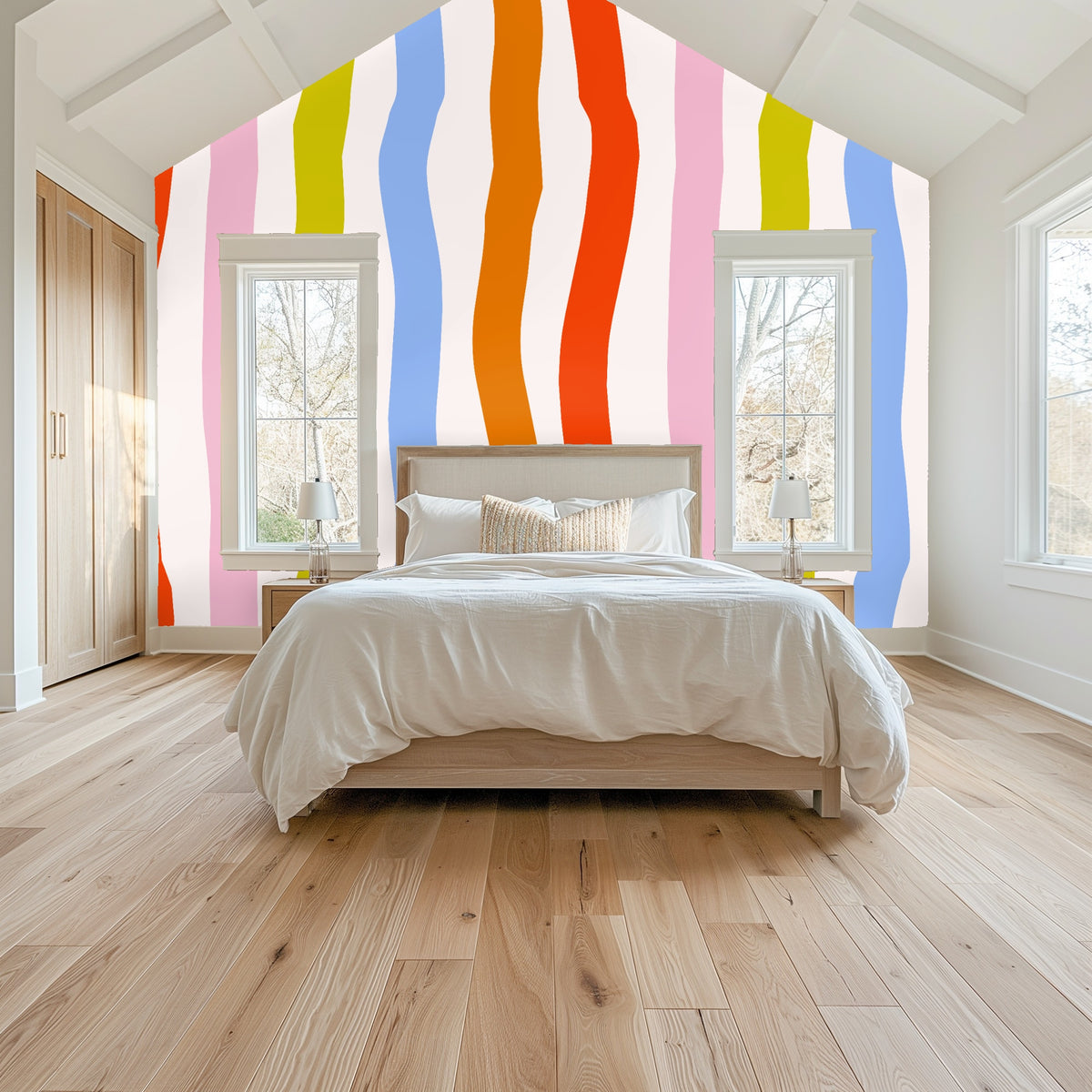 Vaulted bedroom with the wavy ribbon wallpaper on the gable wall, tall stripes framing windows and rising above the bed