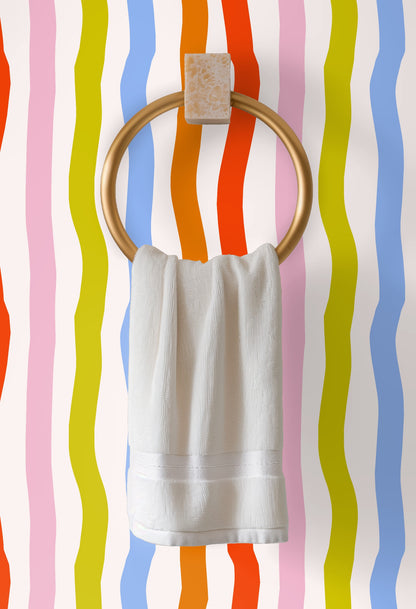 Detailed wall shot of the ribbon stripes illustrating the hand-drawn irregular edges and the pale cream background