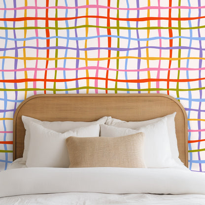 Full-pattern view of Ribbon Lattice showing wavy hand-drawn grid in coral, pink, gold, olive, periwinkle and lavender on a soft cream ground